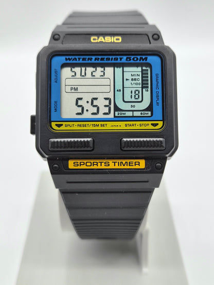 A Casio sports timer watch with a black rugged case and strap, featuring a blue and yellow digital display screen.