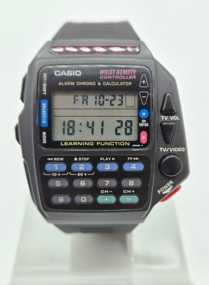Vintage Casio CMD-40 Remote Control digital watch with calculator and learning function, close-up of LCD display and control buttons.